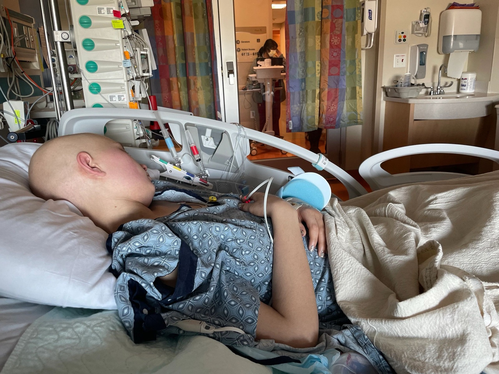 Julia resting in her hospital bed